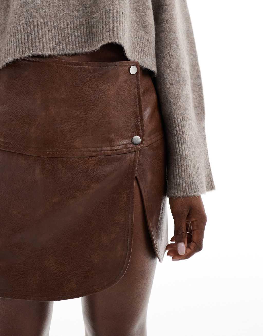 ASOS DESIGN snap detail leather look mini skirt in washed brown Product Image