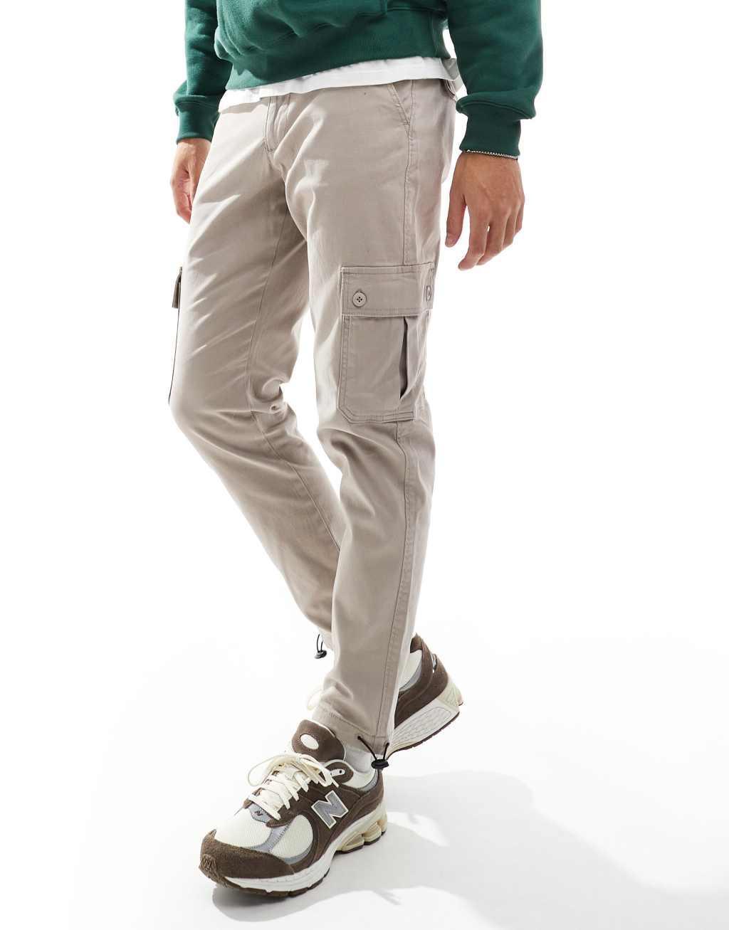 ASOS DESIGN tapered cargo pants in beige Product Image