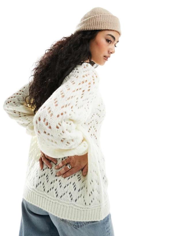 ASOS DESIGN crew neck sweater in loose pointelle stitch in cream Product Image