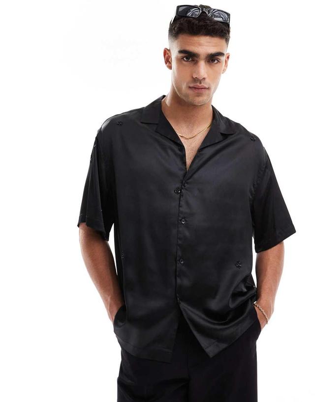 ASOS DESIGN oversized boxy revere embellished satin shirt in black Product Image