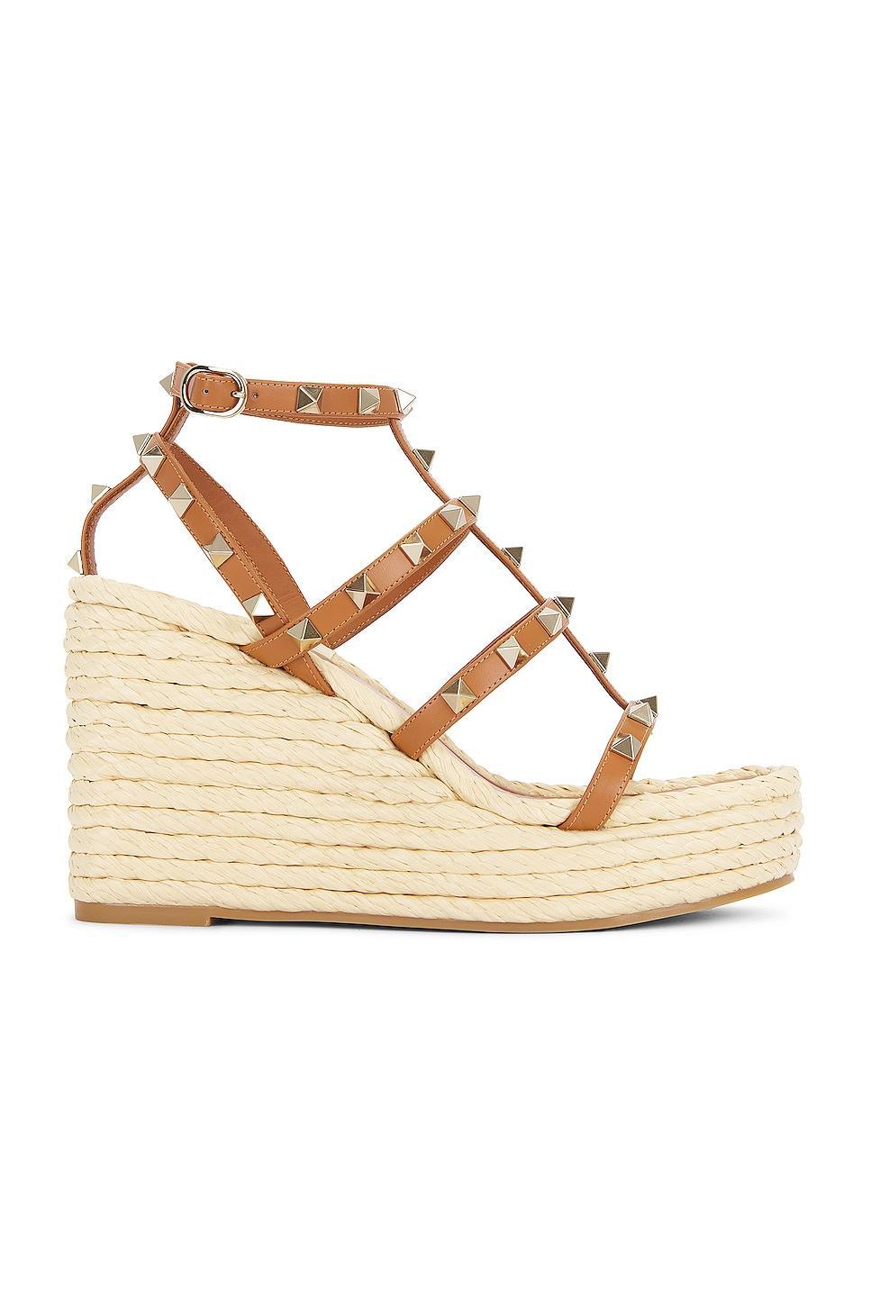 Valentino Garavani Rockstud Espadrille Wedge in Almond Beige & Naturale - Beige. Size 37 (also in 39, 41). Product Image