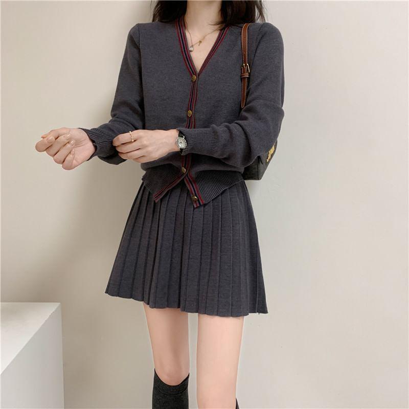 Set: V-Neck Contrast Trim Button-Up Cardigan + High Waist Plain Pleated Knit Mini A-Line Skirt Product Image