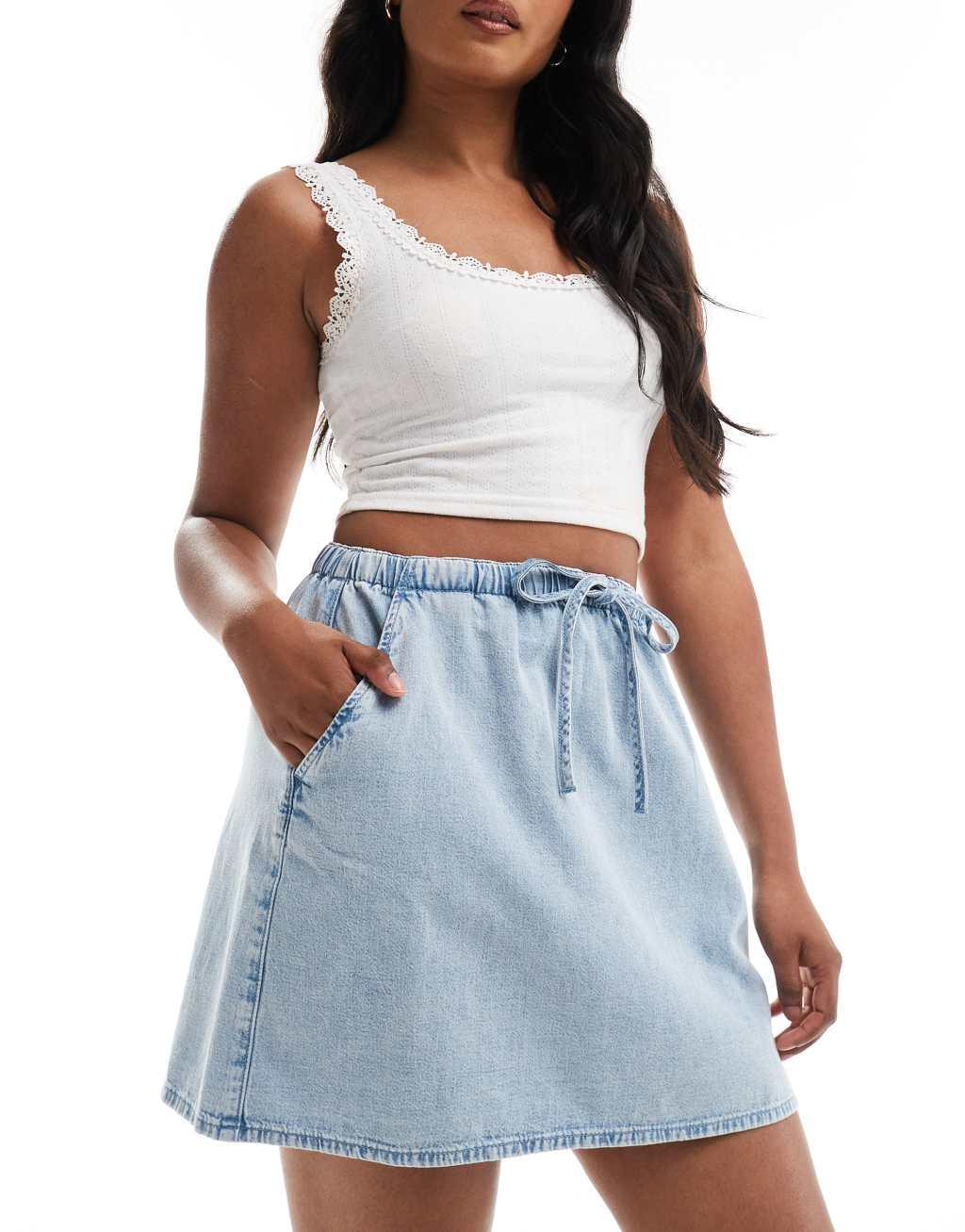 ASOS DESIGN soft denim pull on mini skirt in light wash Product Image