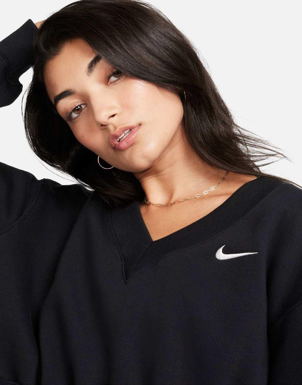 Nike mini swoosh v-neck cropped sweatshirt in black Product Image