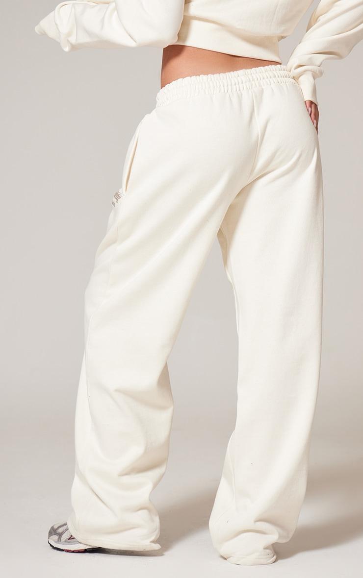 PRETTYLITTLETHING Cream Premium Print Wide Leg Joggers Product Image