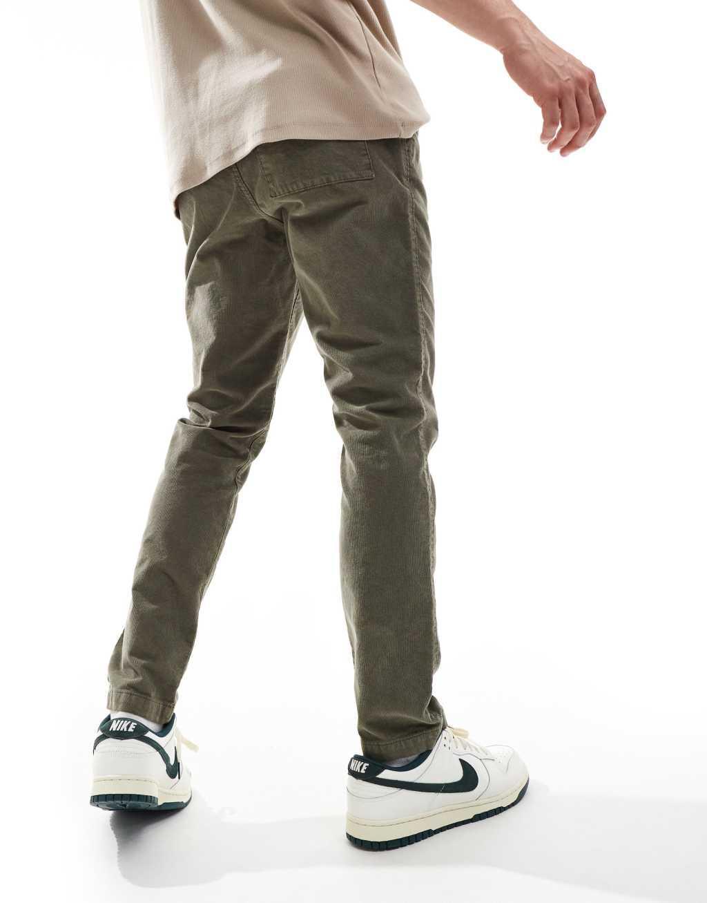 ASOS DESIGN tapered fit corduroy pants with elastic waist in khaki Product Image