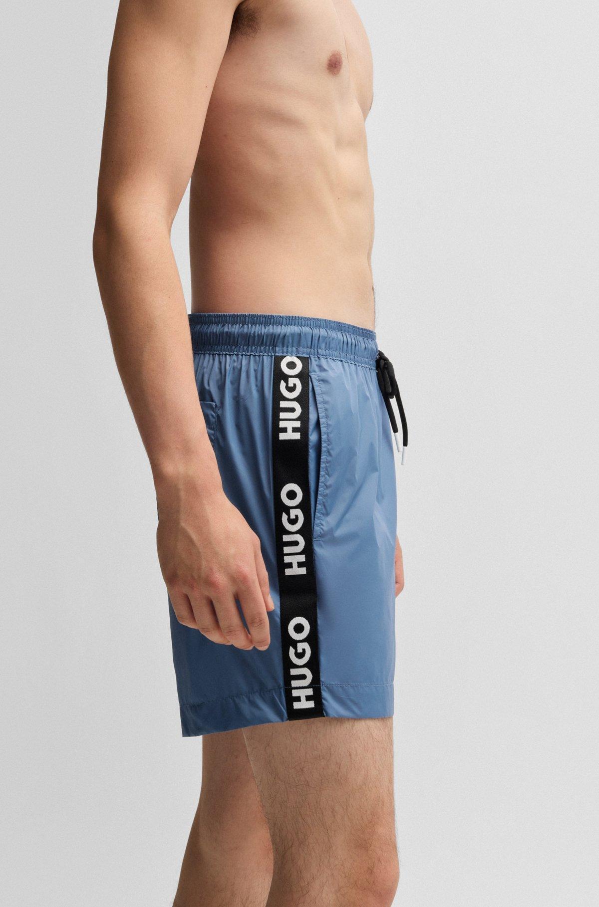 Fully lined swim shorts with logo tape Product Image