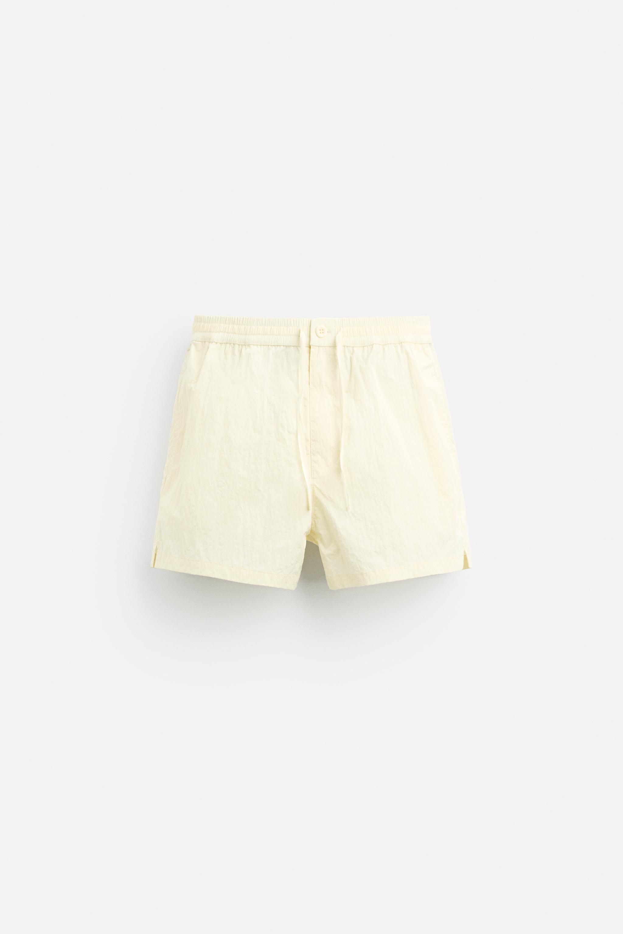 BUTTON SHORT SWIMMING TRUNKS Product Image