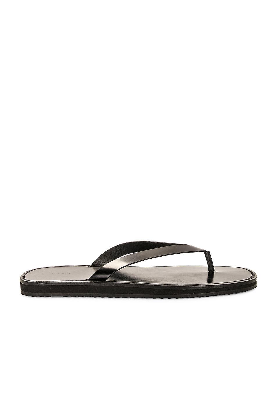 The Row City Flip Flop in Black - Black. Size 38.5 (also in 37.5, 38, 40). Product Image