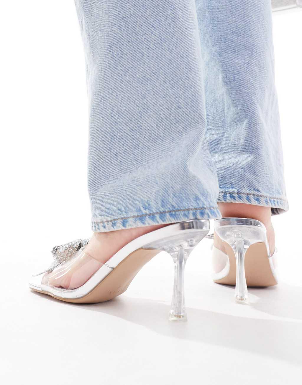 Simmi London Wide Fit Ashleigh clear mid heeled mules with embellished bow in silver Product Image