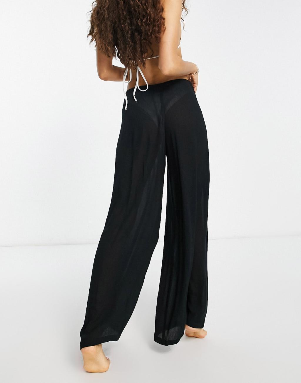 ASOS DESIGN Petite drawstring palazzo beach pants in black Product Image