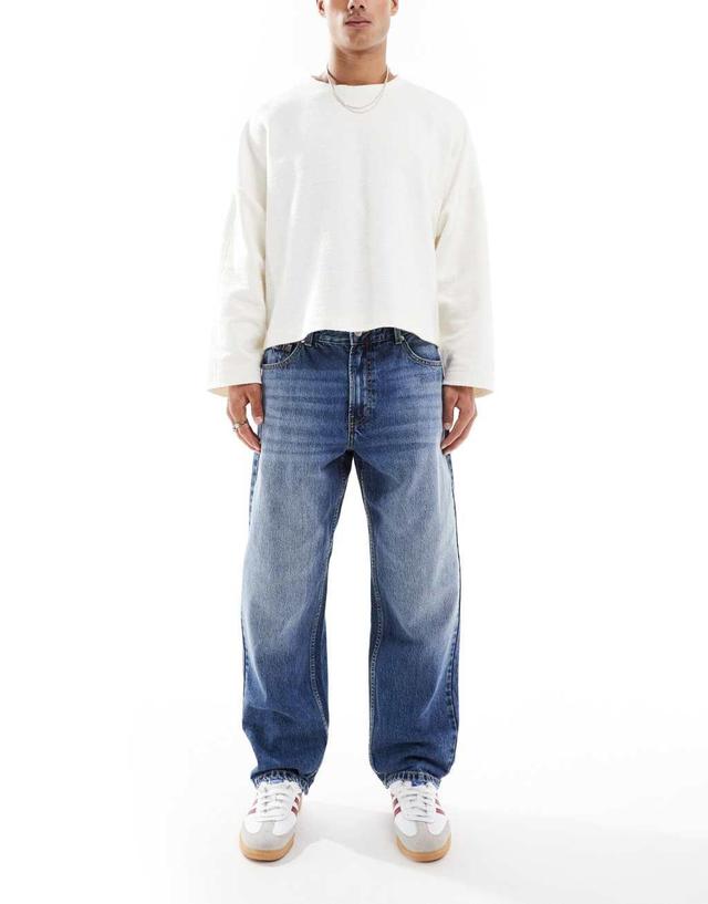 Bershka washed horseshoe jeans in blue  Product Image