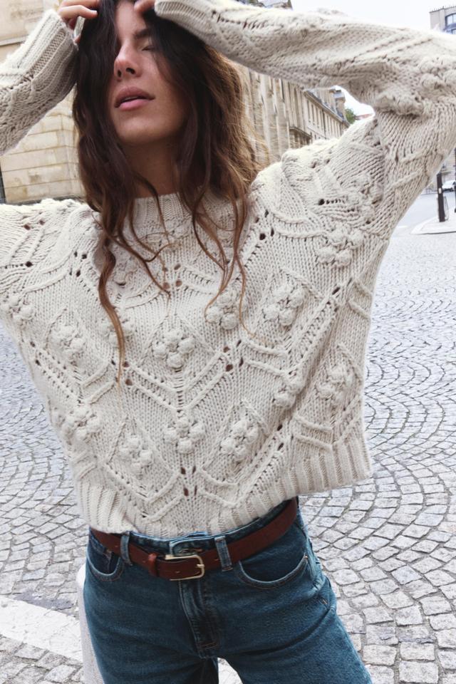 CABLE KNIT SWEATER WITH POMPOMS Product Image