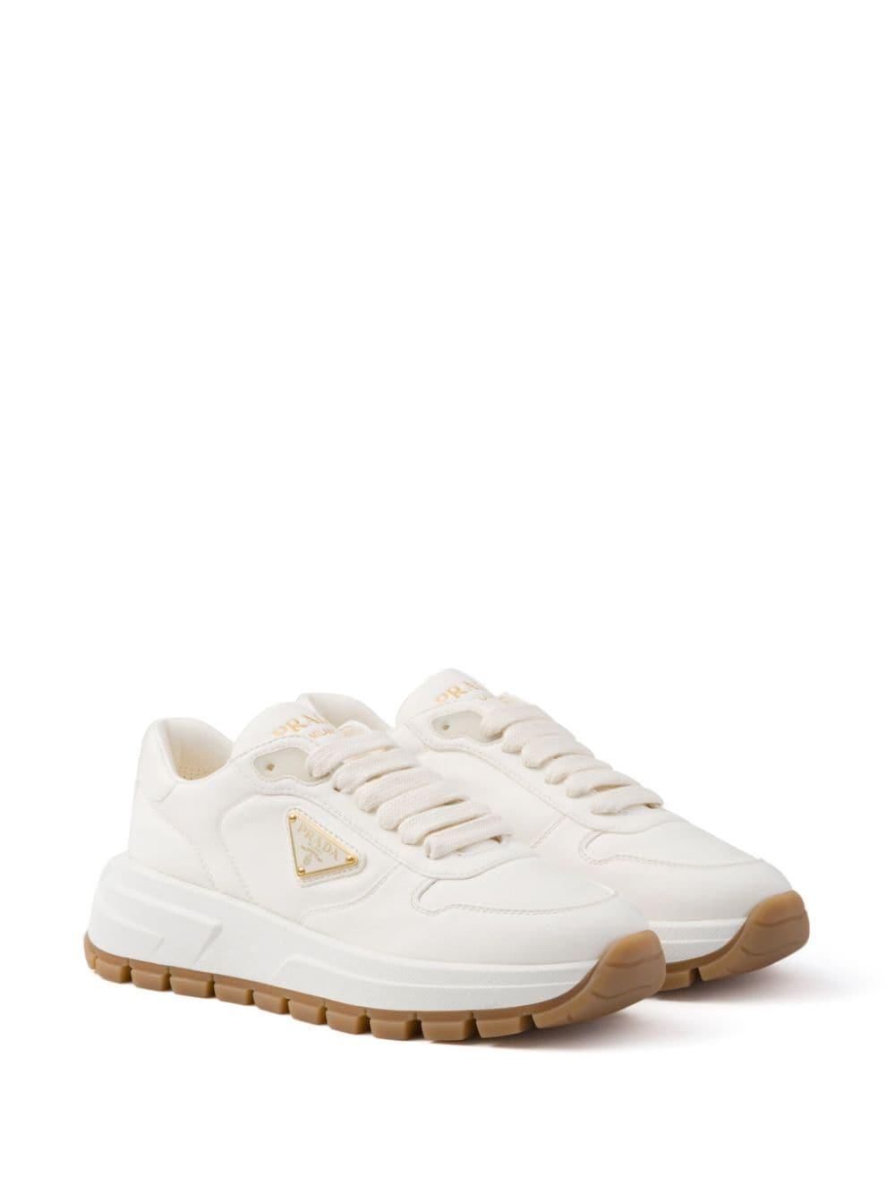 Leather Logo Runner Sneakers In White Product Image