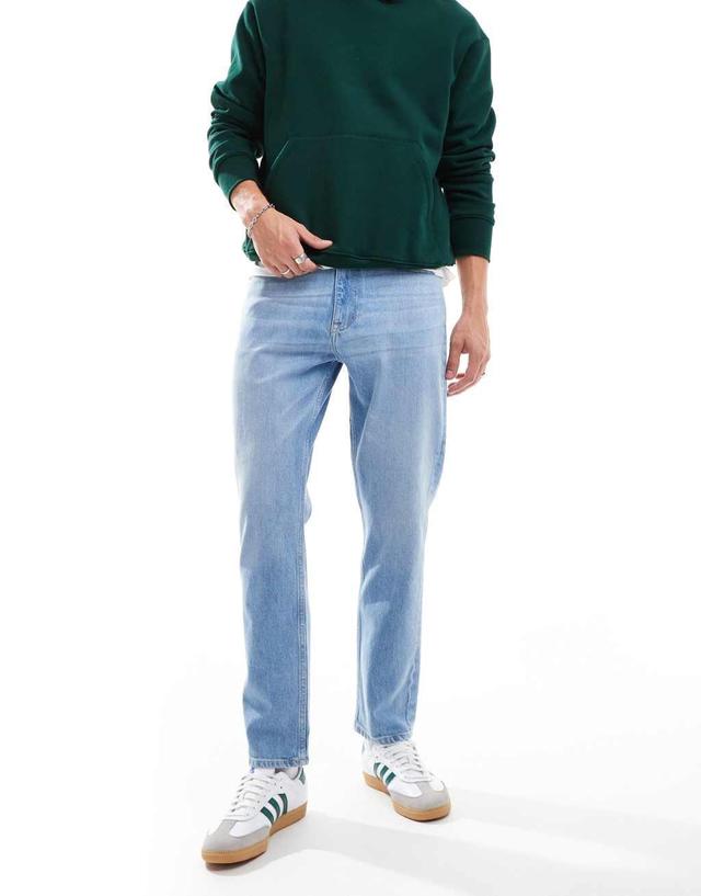 Tommy Jeans regular tapered dad jeans in mid wash Product Image