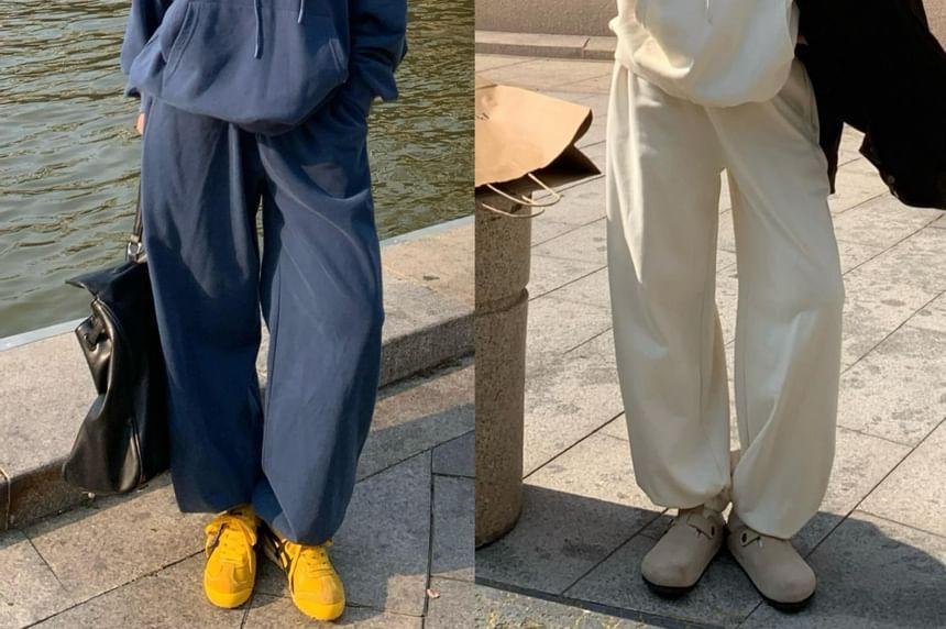 Plain Pocket Detail Oversized Hoodie / Mid Waist Harem Pants Product Image