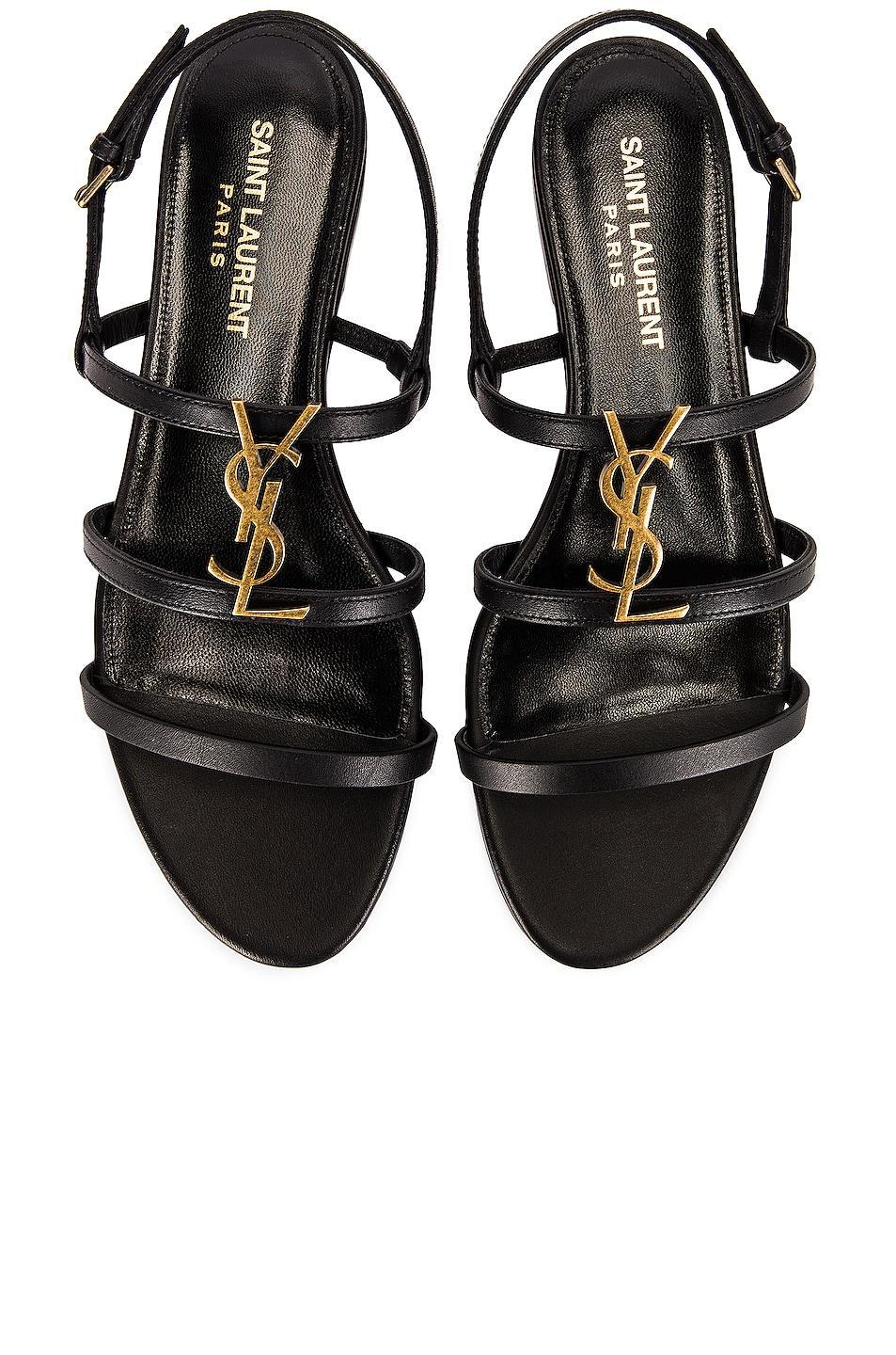 Saint Laurent Cassandra Leather Flat Sandals in Black Product Image