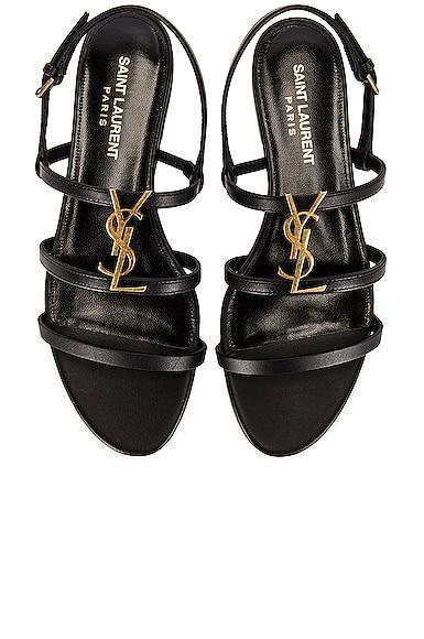 Saint Laurent Cassandra Leather Flat Sandals in Black Product Image