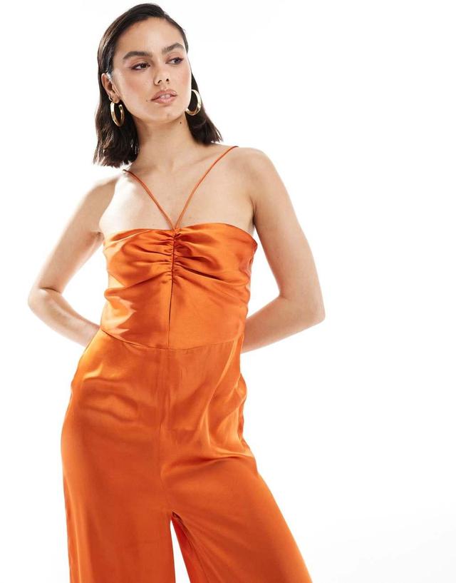 ASOS DESIGN halter tie ruched front straight leg satin jumpsuit in rust Product Image