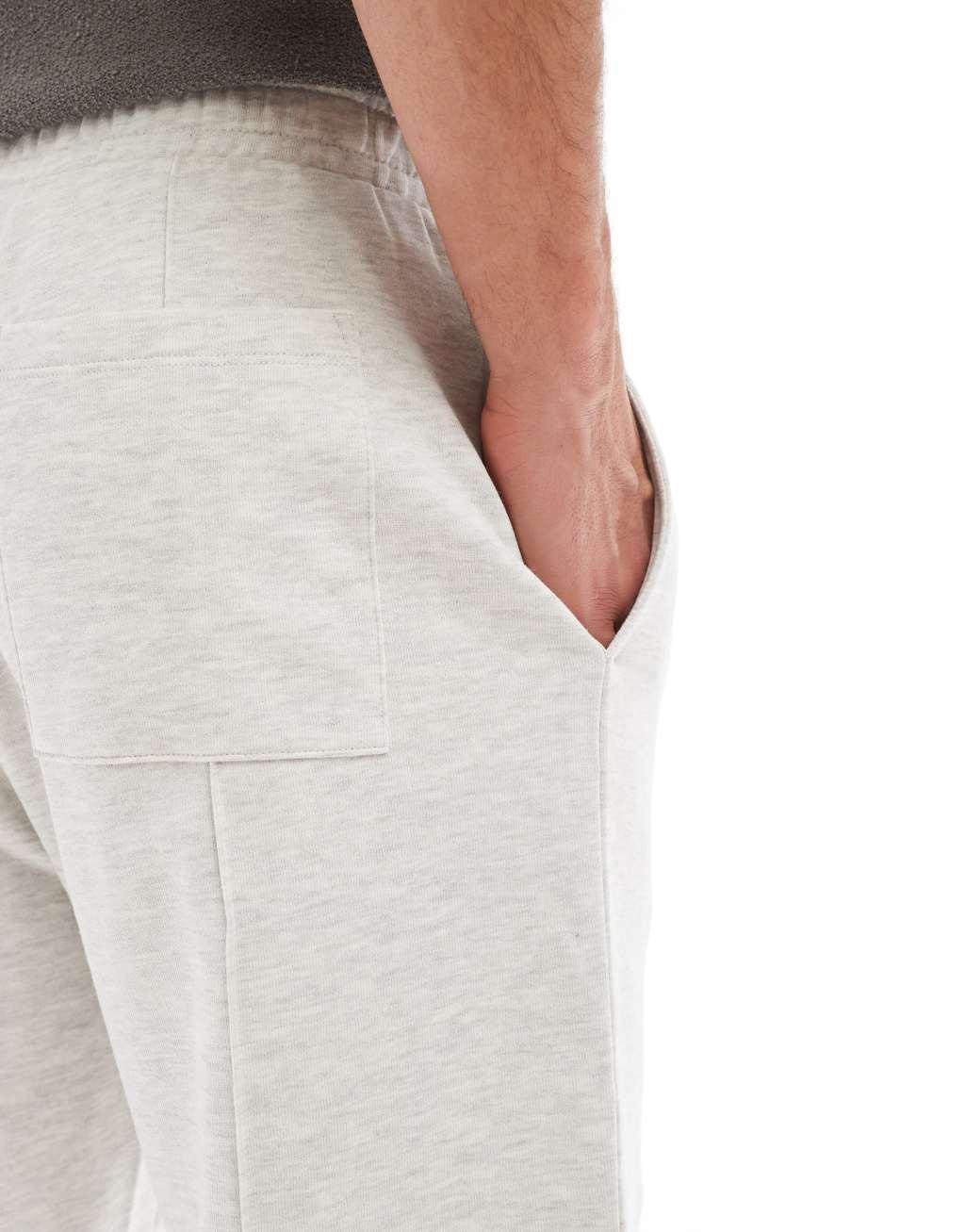 ASOS DESIGN tapered sweatpants with zip fastening in heather gray Product Image