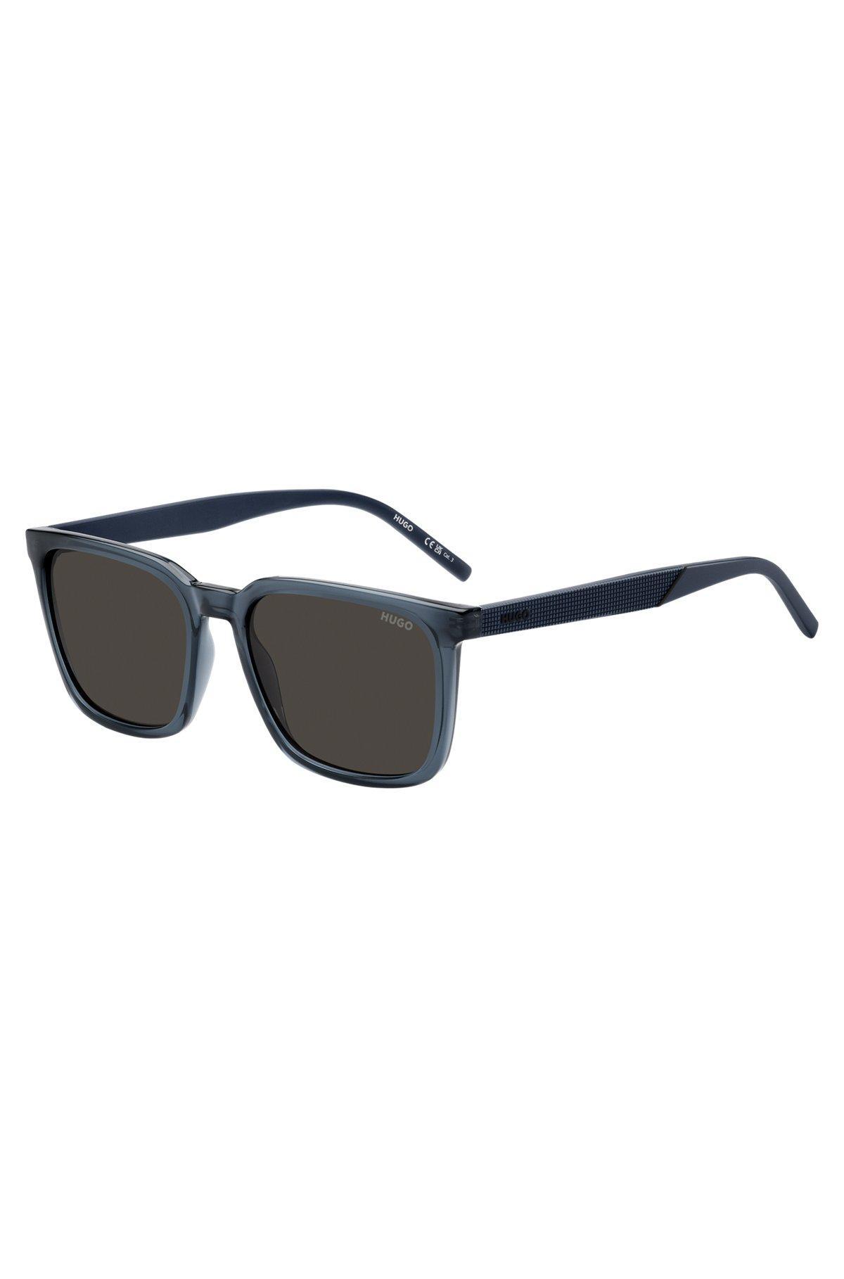 Blue sunglasses with textured temples Product Image