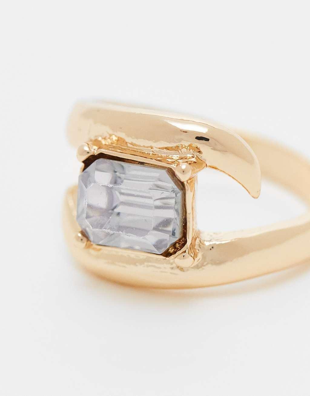 ASOS DESIGN ring with wrap around crystal detail in gold tone Product Image