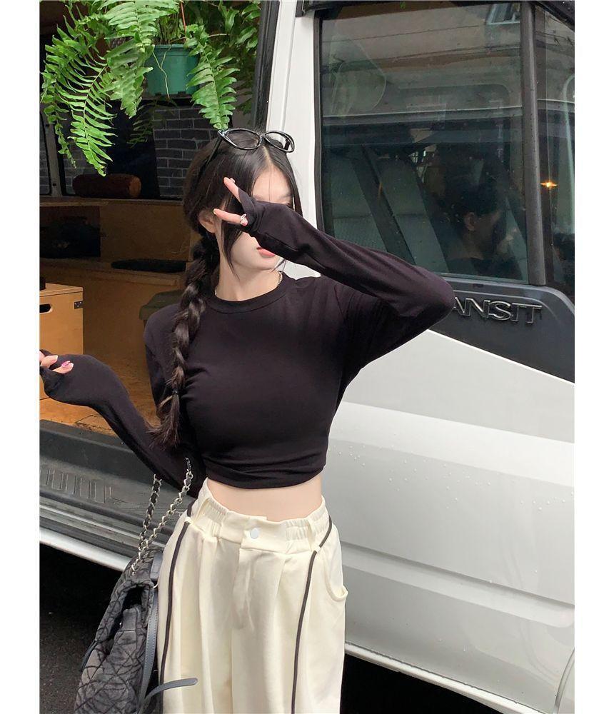 Long-Sleeve Round Neck Plain Cutout Crop Tee / Drawstring Waist Striped Wide Leg Sweatpants Product Image