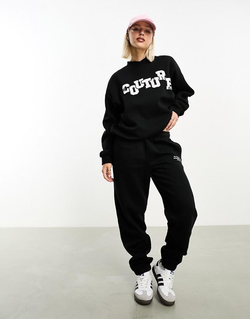 The Couture Club applique sweatpants in black Product Image