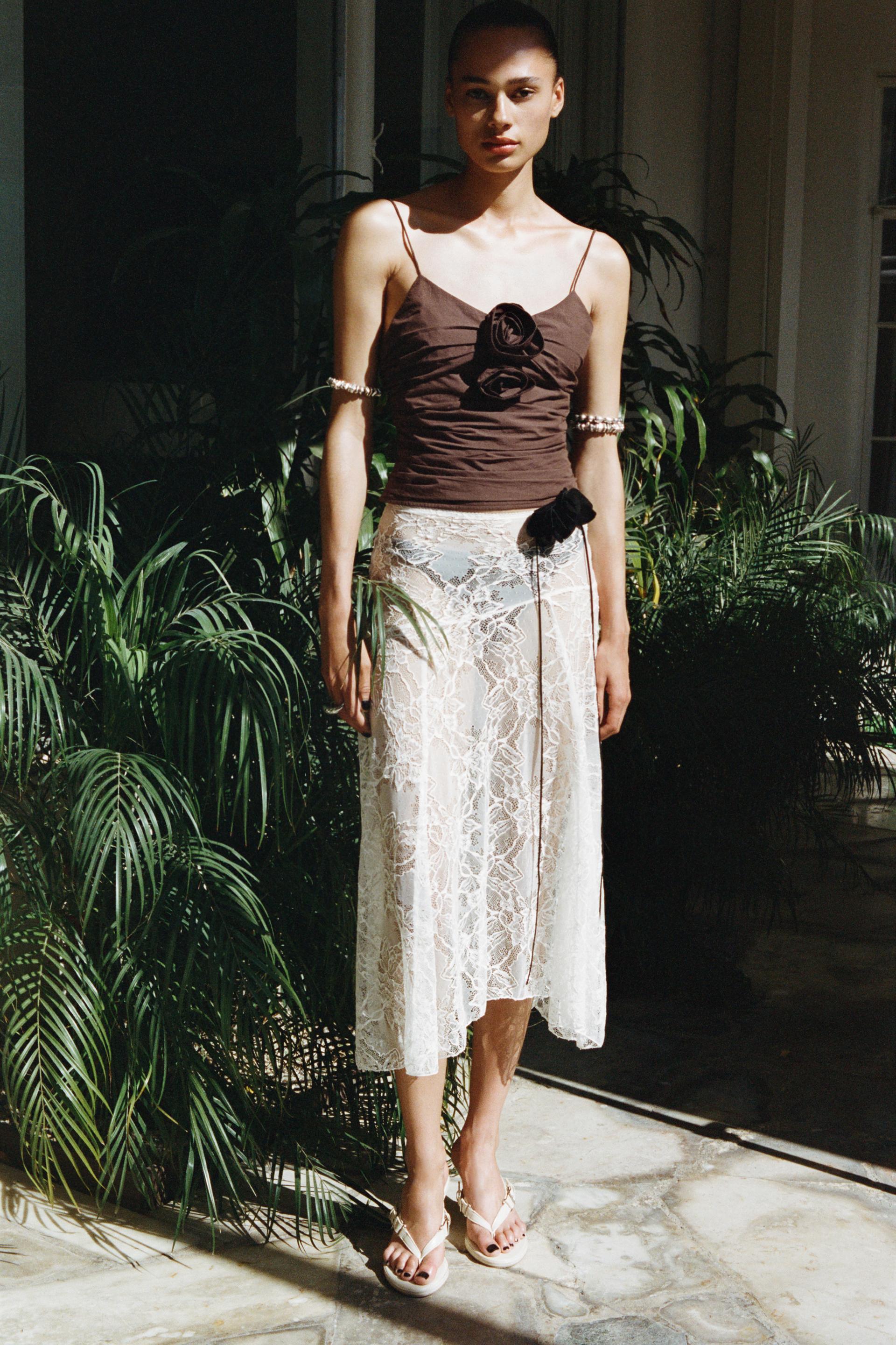 DRAPED TOP WITH TEXTURED FLOWERS Product Image