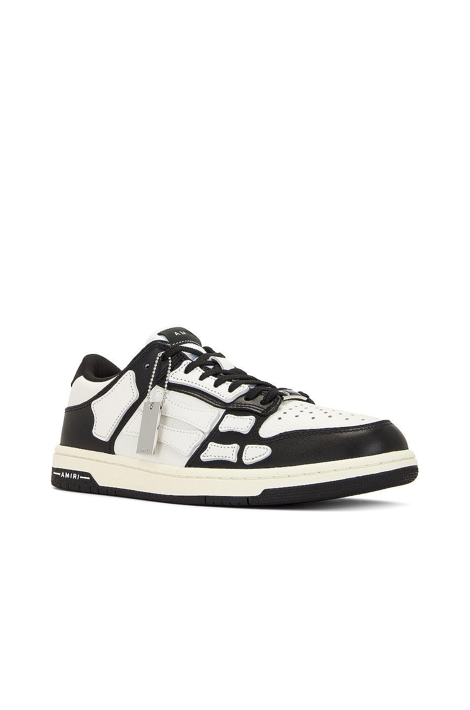 Amiri Skel Top Low Sneaker in Black & White - Black. Size 42 (also in 40, 41, 43, 44, 45, 46, 47, 48). Product Image