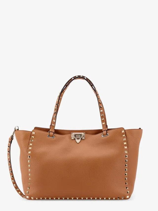 VALENTINO GARAVANI Rockstud Medium Top Handle Bag In Brown Product Image