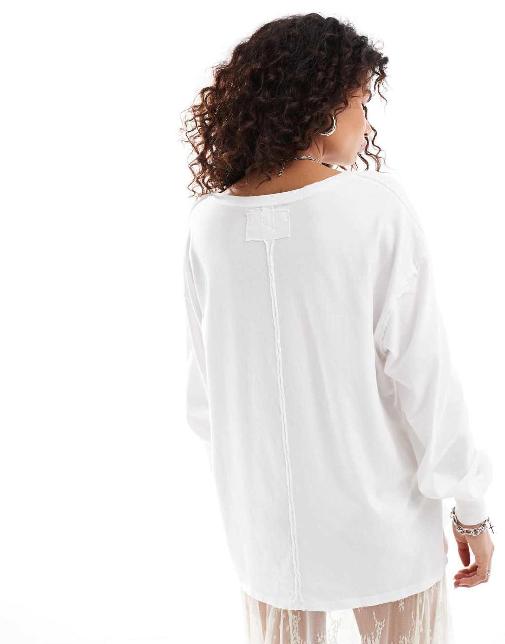 Free People Fade long sleeve patch pocket T-shirt in ivory Product Image