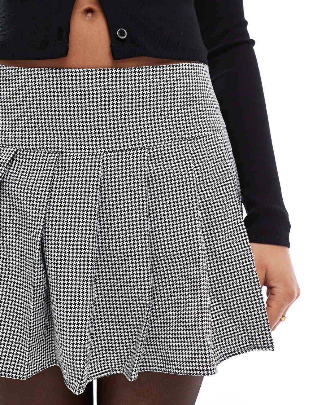 ASOS DESIGN pleated mini skirt in black & white plaid Product Image