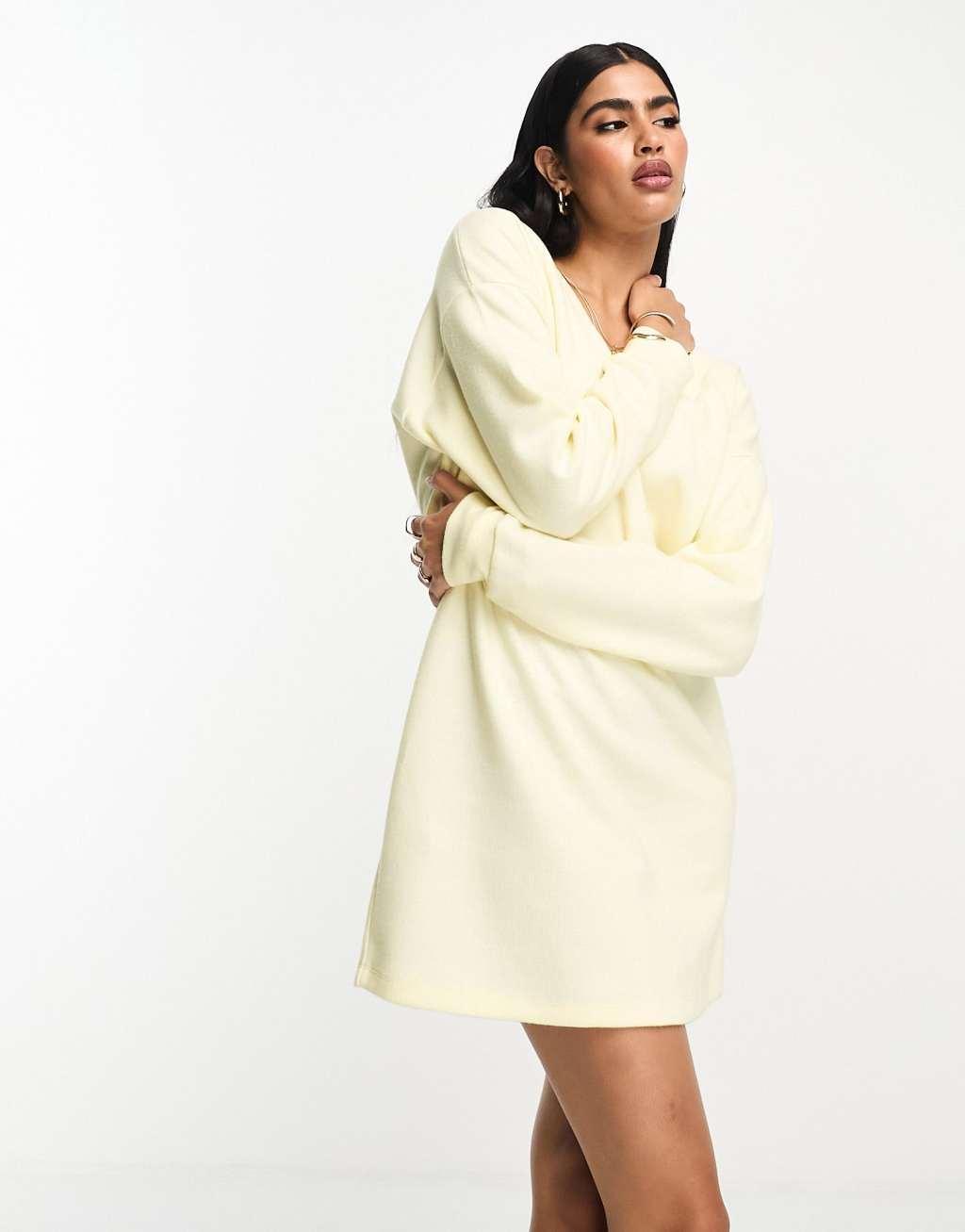 ASOS DESIGN super soft slouchy v neck sweater mini dress in white Product Image