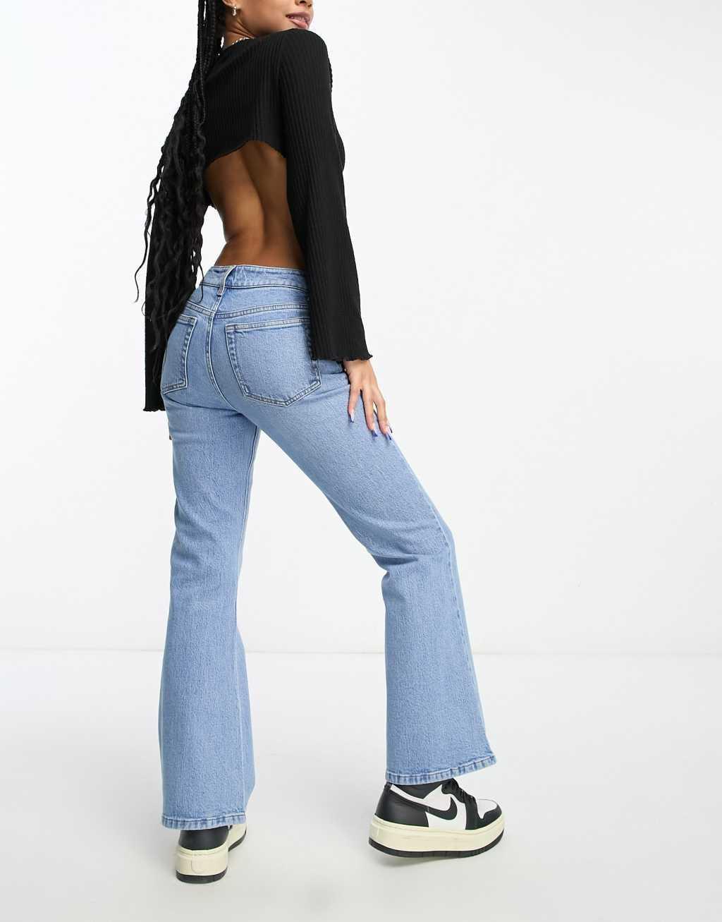 ASOS DESIGN Petite mid rise flare jeans in light blue Product Image