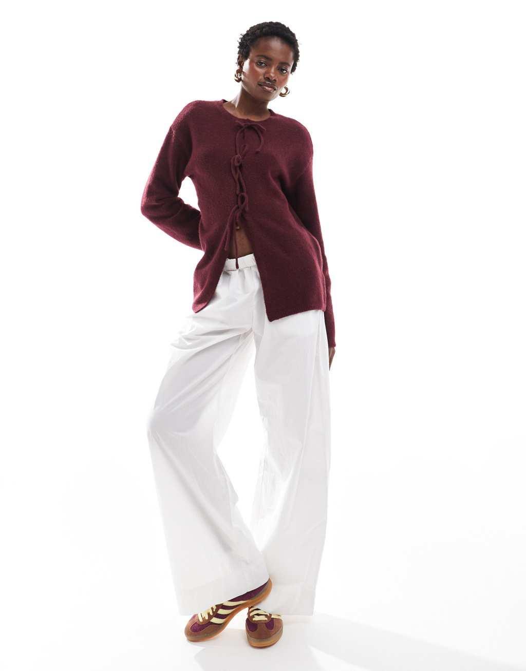 Monki knit bow tie up cardigan in burgundy Product Image