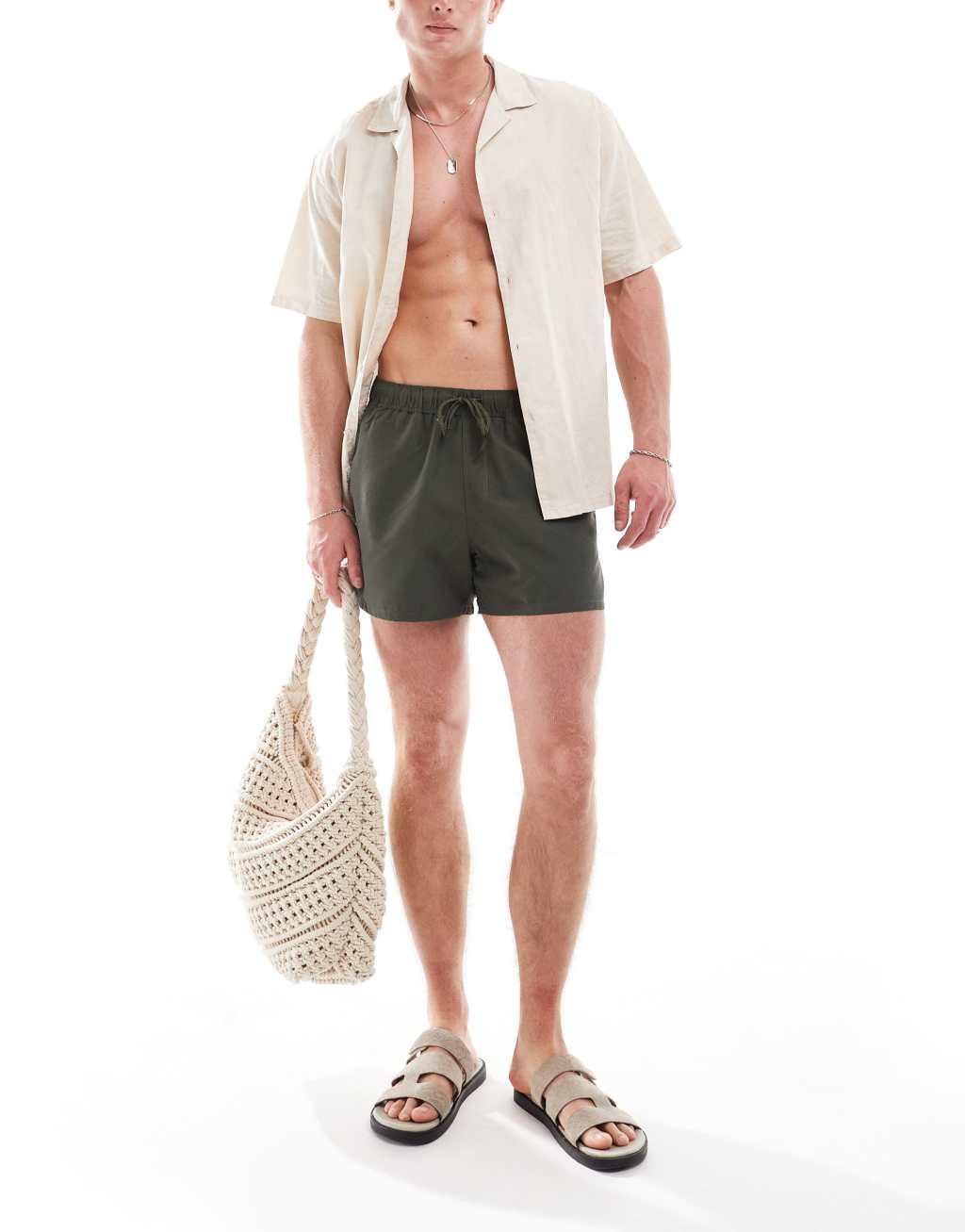 ASOS DESIGN swim shorts in short length in olive  Product Image