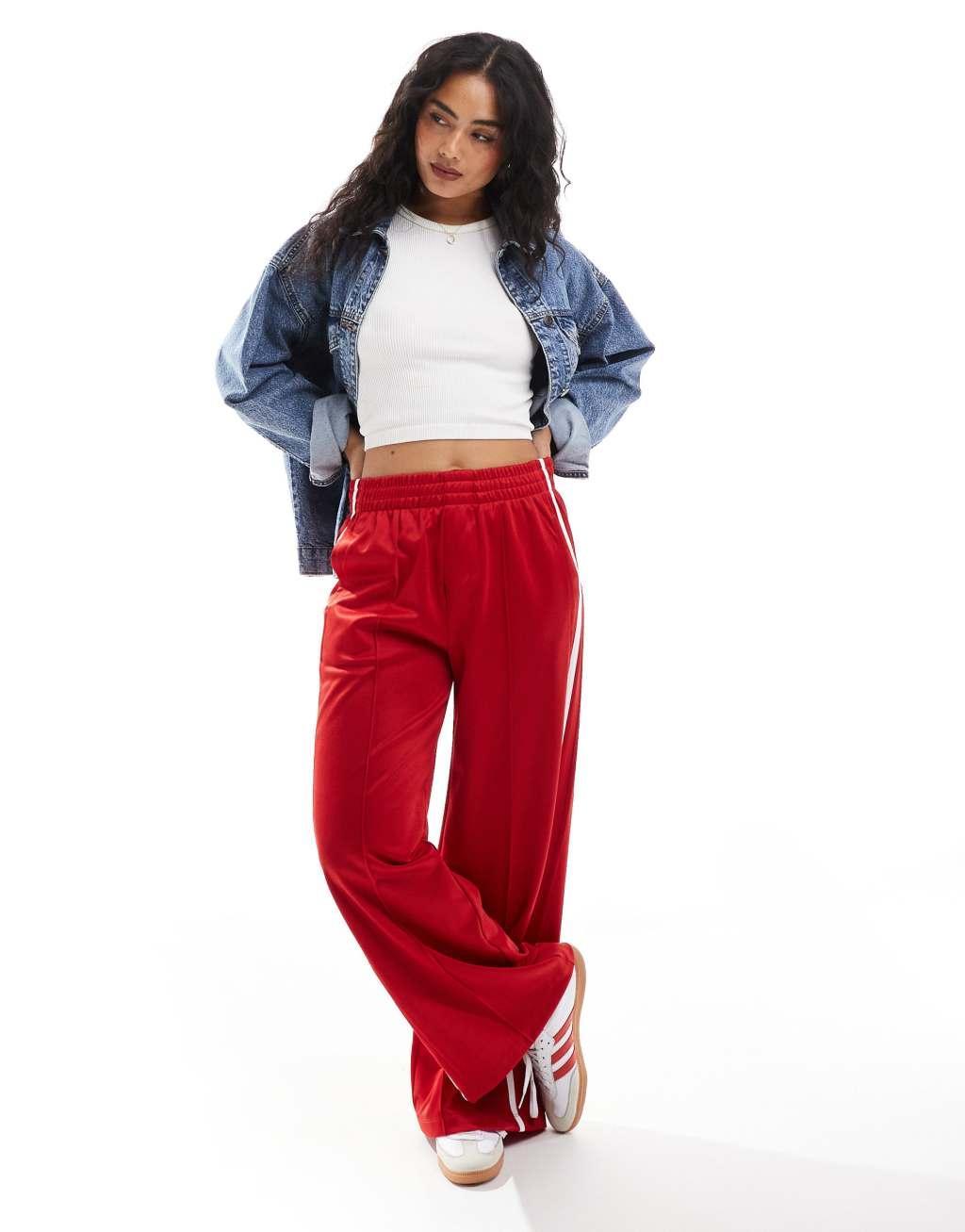 Bershka wide leg piping detail sweatpants in red Product Image