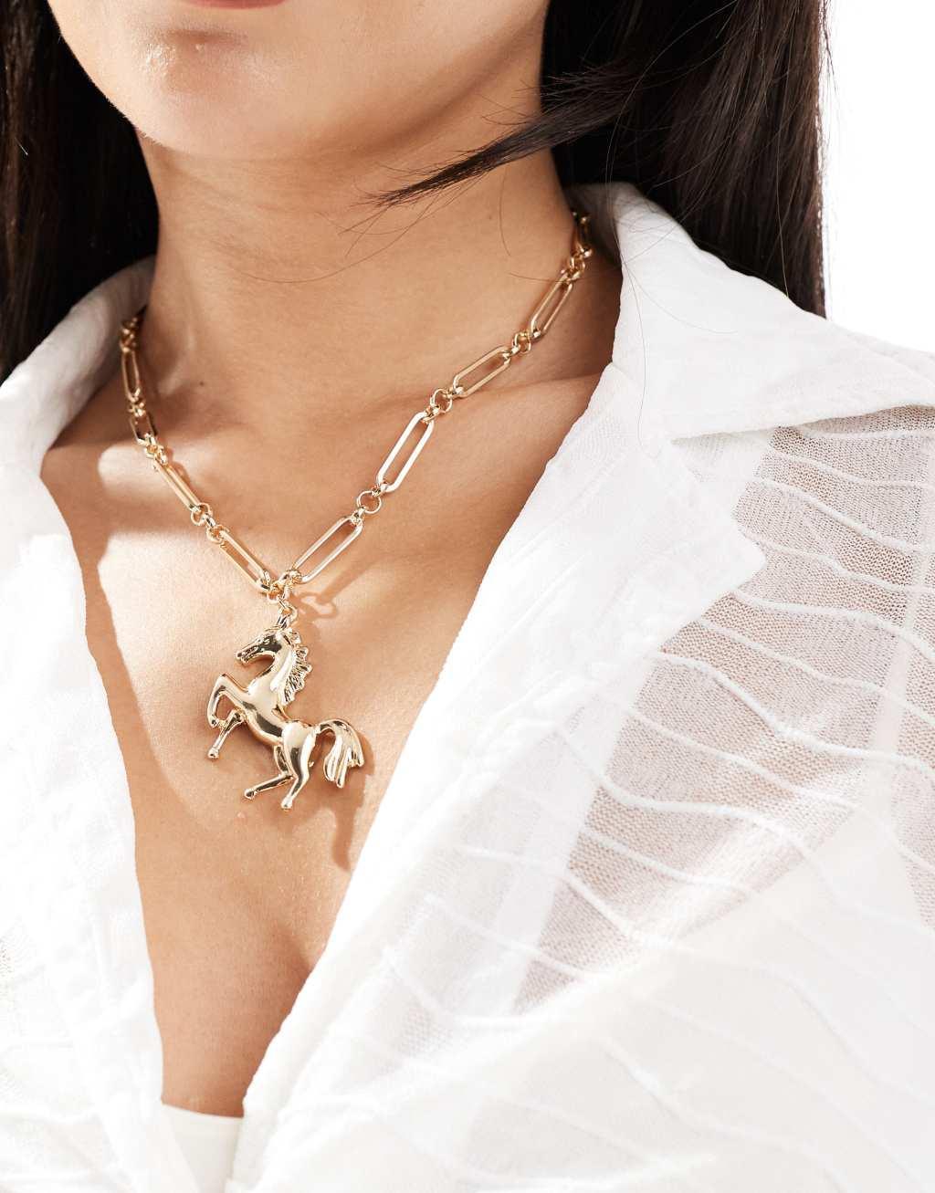 ASOS DESIGN long necklace with horse pendant in gold tone Product Image