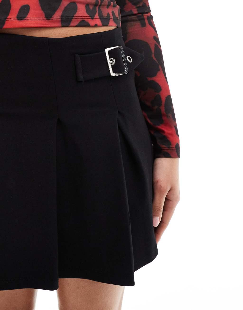 ASOS DESIGN pleated mini skirt with buckle detail in black Product Image