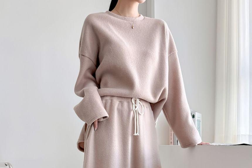 Set: Long-Sleeve Plain Loose-Fit Top + Drawstring Waist A-Line Midi Skirt Product Image