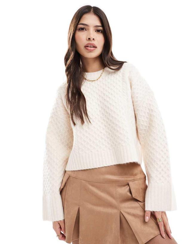 ASOS DESIGN crew neck boxy sweater with wide cuff in cable knit in cream Product Image