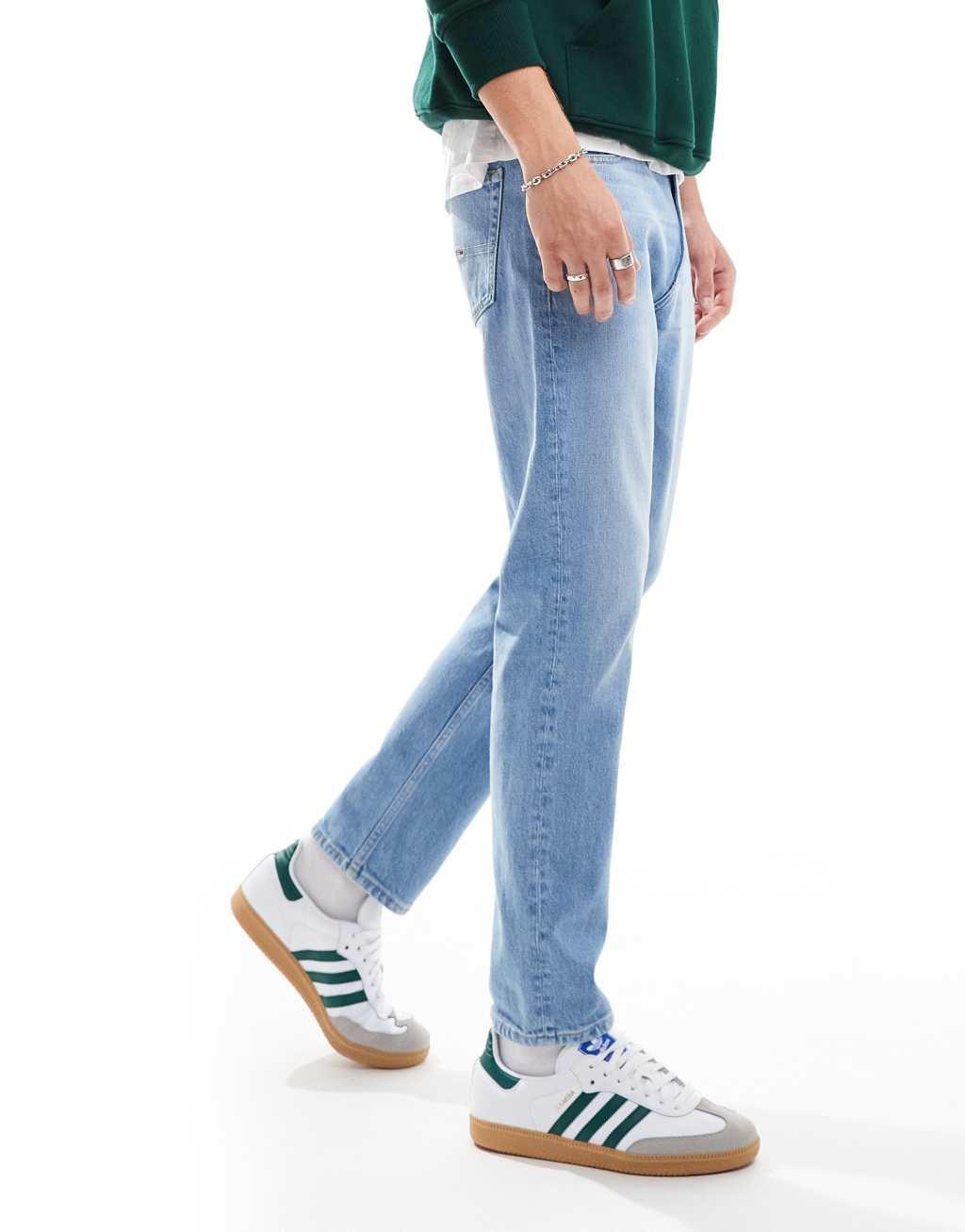 Tommy Jeans regular tapered dad jeans in mid wash Product Image