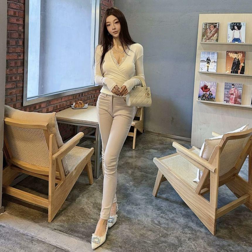 Long Sleeve V-Neck Plain Panel Lace Wrap Top / High Rise Plain Shorts / High Rise Plain Skinny Pants / Flared Pants Product Image