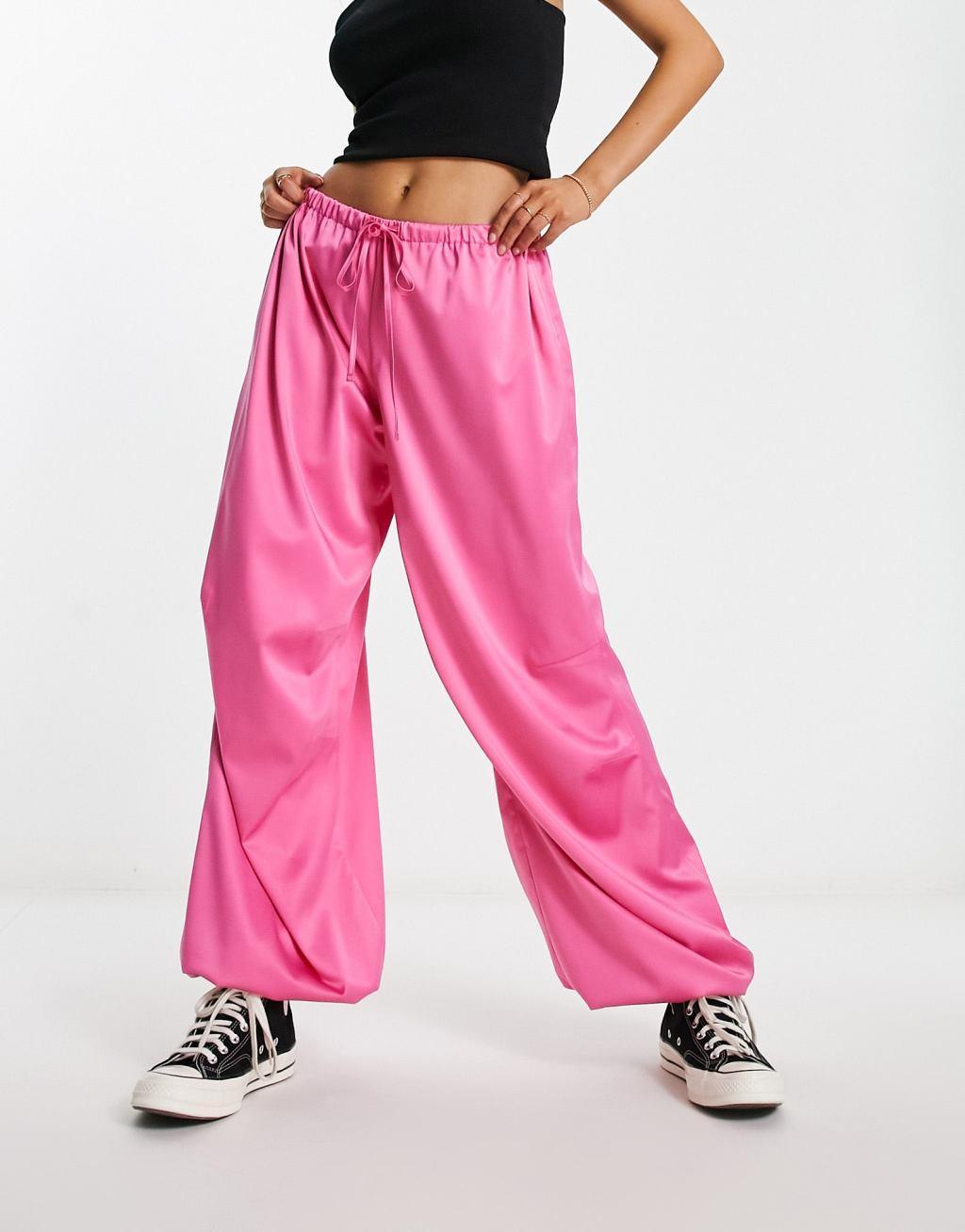 ASOS DESIGN satin parachute pants in pink Product Image