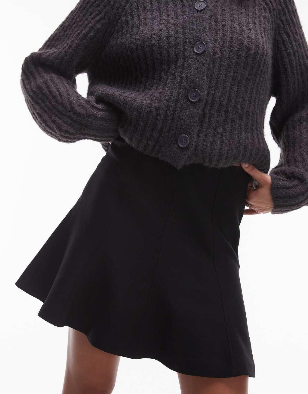 ARKET sculptural flippy mini skirt in black Product Image