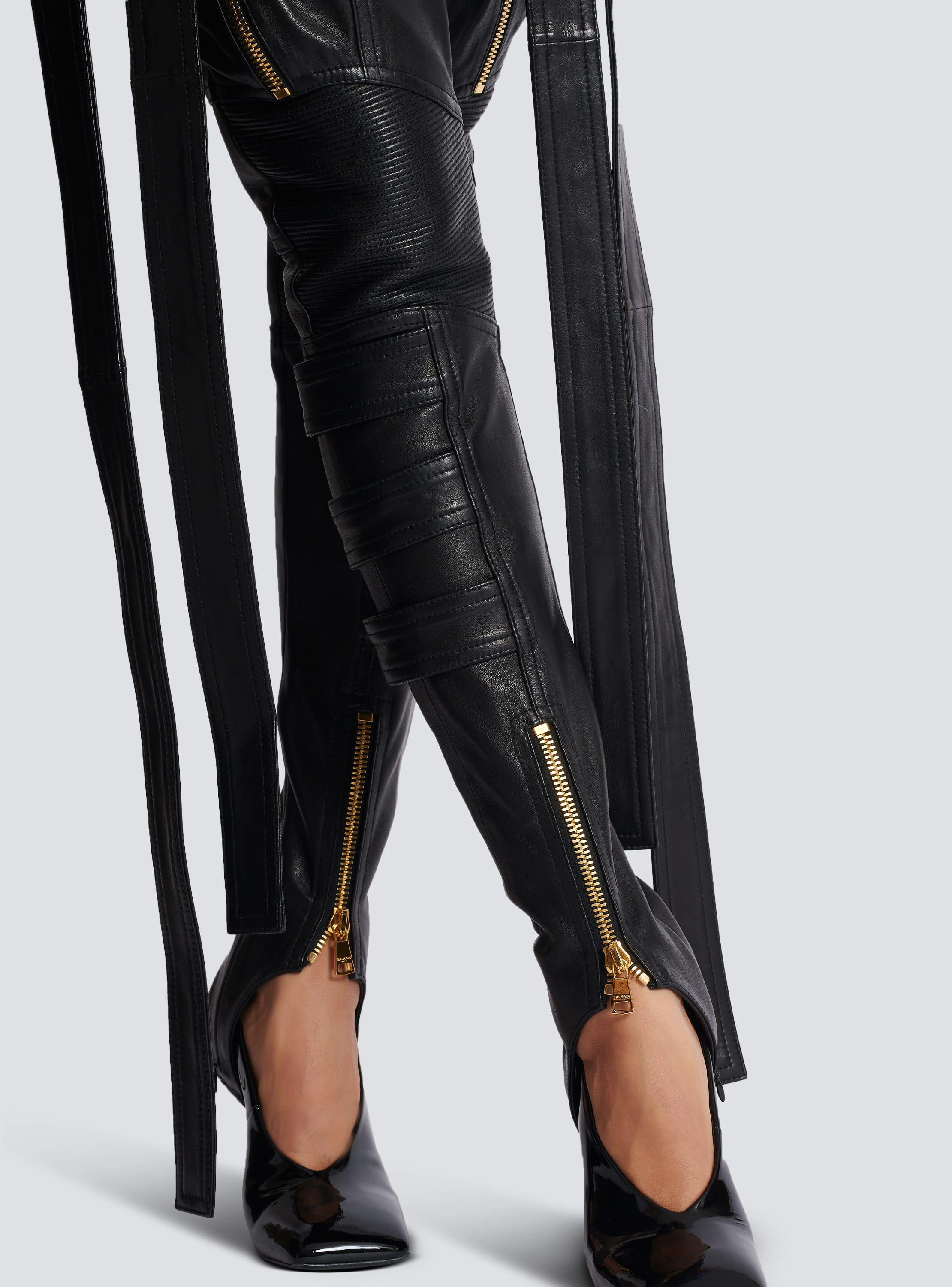 Leather cargo trousers with straps Product Image