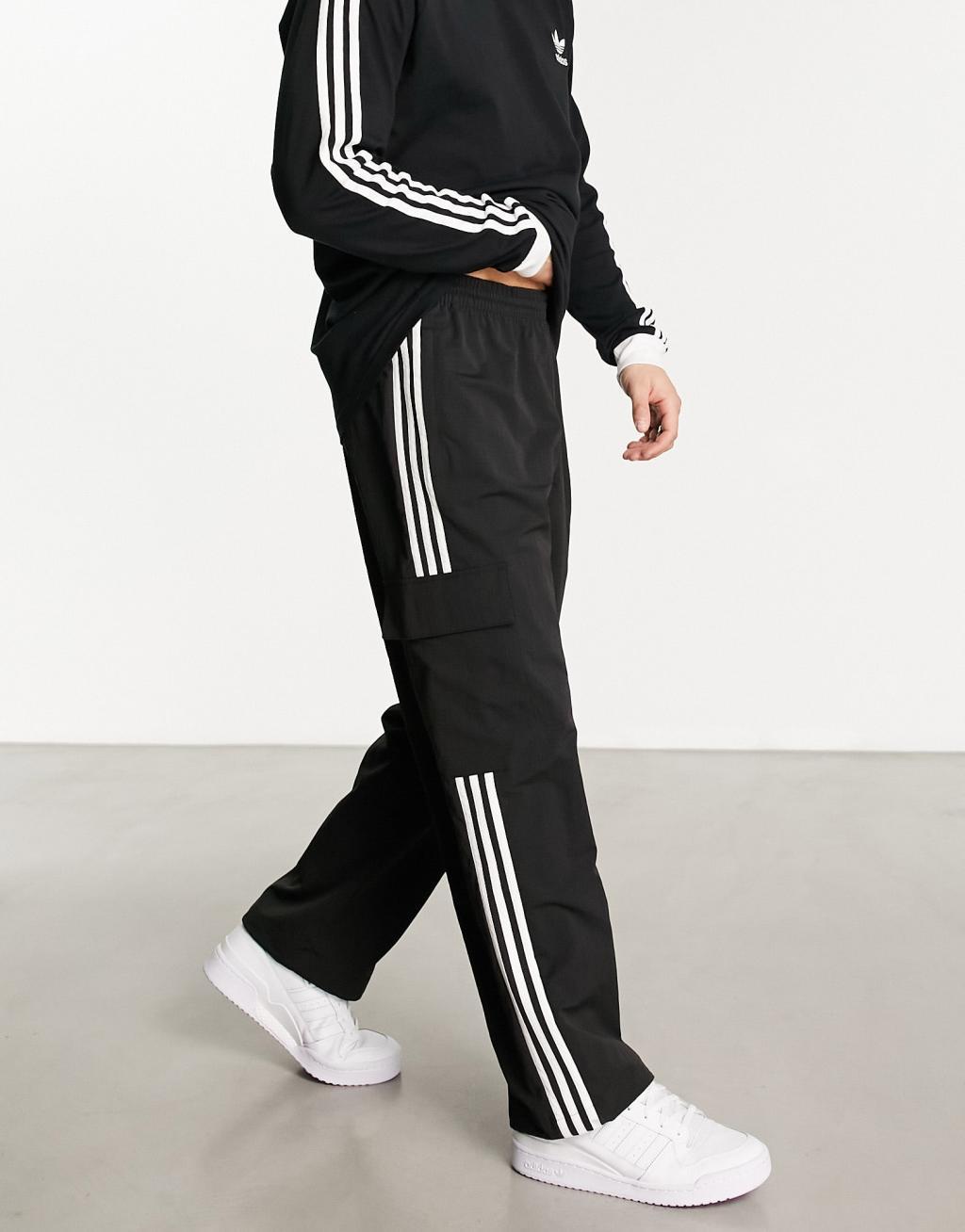 adidas Originals 3 stripe cargo pants in black Product Image