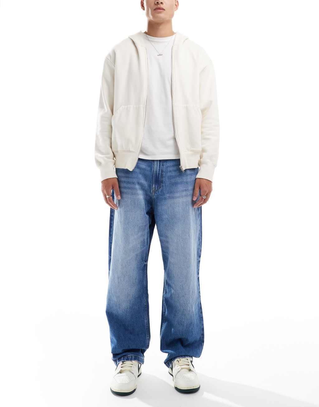 Bershka baggy jeans in mid blue Product Image