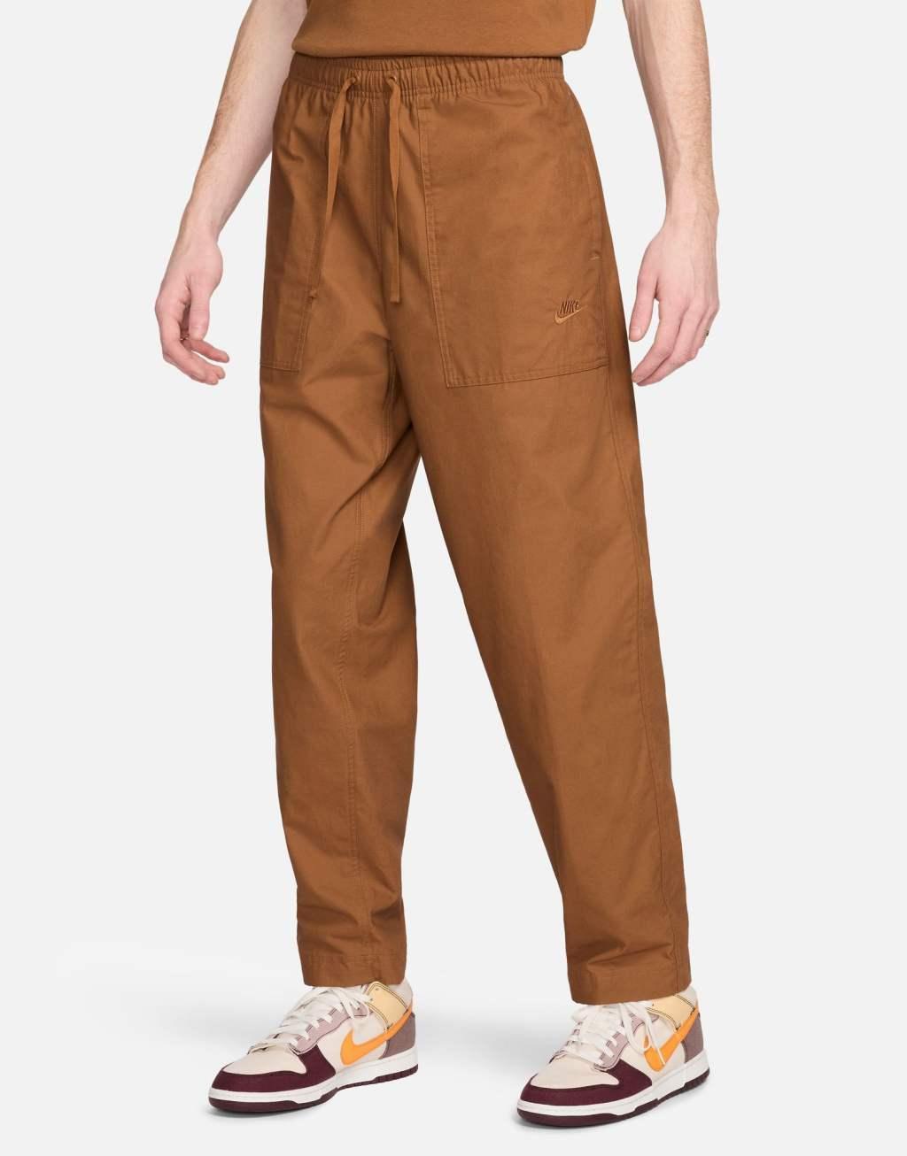 Nike Club woven Barcelona pants in brown Product Image